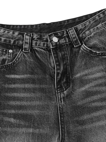 Kurze Jeanshose aus gewaschenem Patchwork-Denim im Used-Look