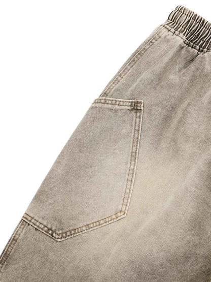 DEKONSTRUKTIERTE DENIM-SHORTS MIT KORDELZUG IM VINTAGE-WASCHVERKLEIDUNG