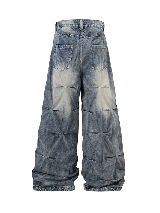 Distressed Washed Pleated Jeans