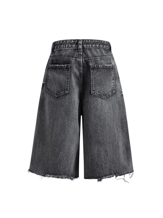 Kurze Jeanshose aus gewaschenem Patchwork-Denim im Used-Look