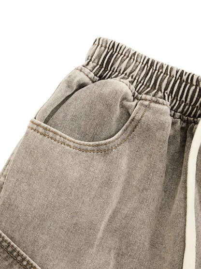 DEKONSTRUKTIERTE DENIM-SHORTS MIT KORDELZUG IM VINTAGE-WASCHVERKLEIDUNG
