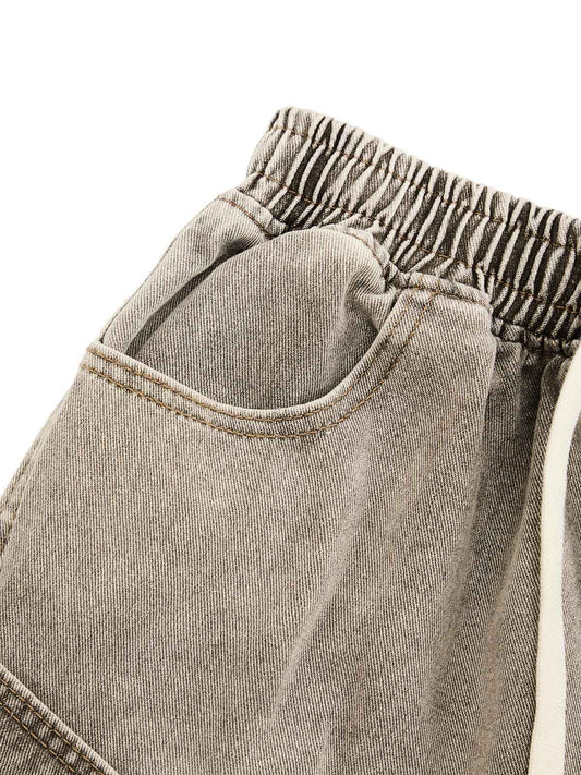 DEKONSTRUKTIERTE DENIM-SHORTS MIT KORDELZUG IM VINTAGE-WASCHVERKLEIDUNG
